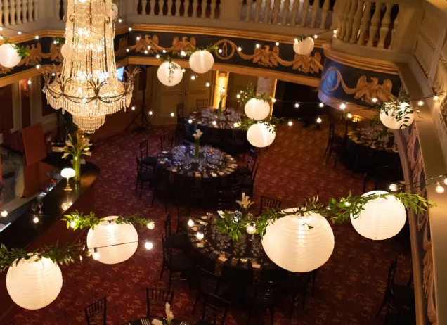 photo from above the lobby full of lanterns and tables